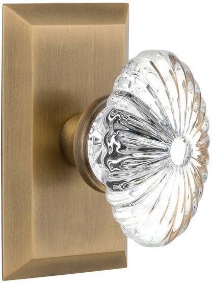 New York Rosette Door Set with Oval Fluted-Crystal Glass Knobs in Antique Brass.